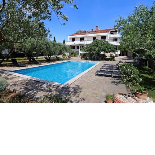 Family friendly apartments with a swimming pool Novalja, Pag - 213