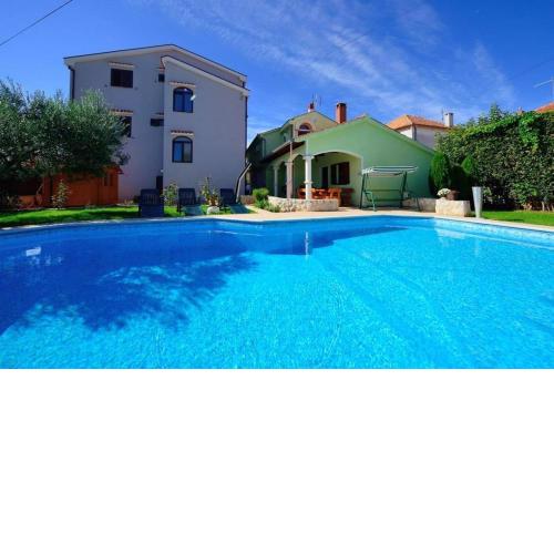 Family friendly apartments with a swimming pool Zadar - 23646