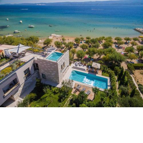 Luxury beachfront VILLA FLORES heated outdoor, indoor pool, whirlpool, sauna