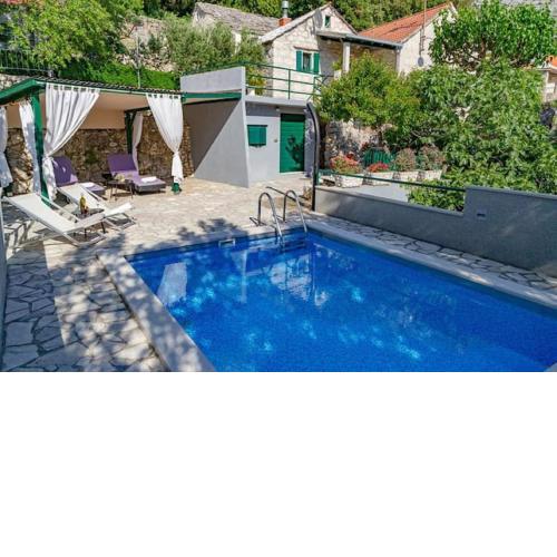 stone house Nikolina with heated Pool