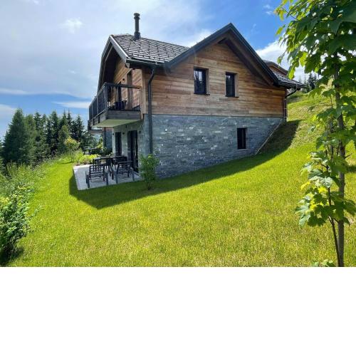 Tomtegl-Bergchalet-No-4-mit-Privatsauna-Infinitypool-Kamin-Fitnessraum-1500m-Seehoehe