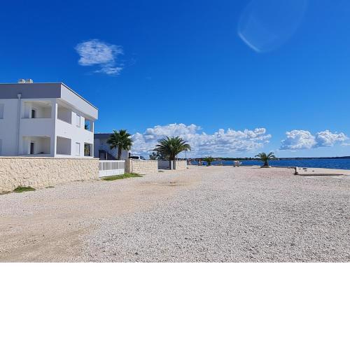 Via apartment first row by the sea