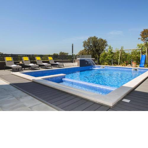 Villa with swimming pool outdoor kitchen sauna jacuzzi play area and sea view